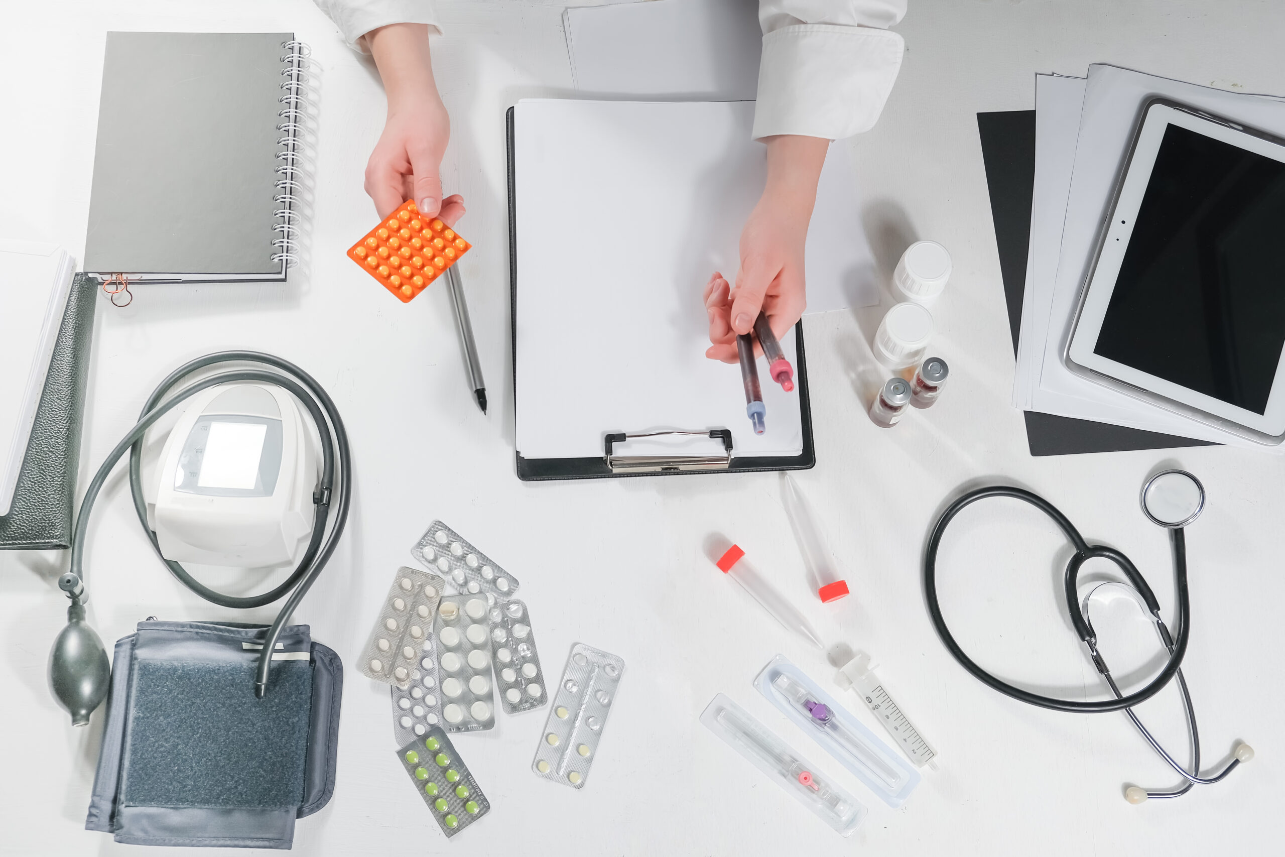 Medicine, doctor sitting at the table and writing a prescription to the patient, remote visit, online treatment, top view, medical background, Medicine, doctor sitting at the table and writing a prescription to the patient, remote visit, online treatment, top view, medical background,