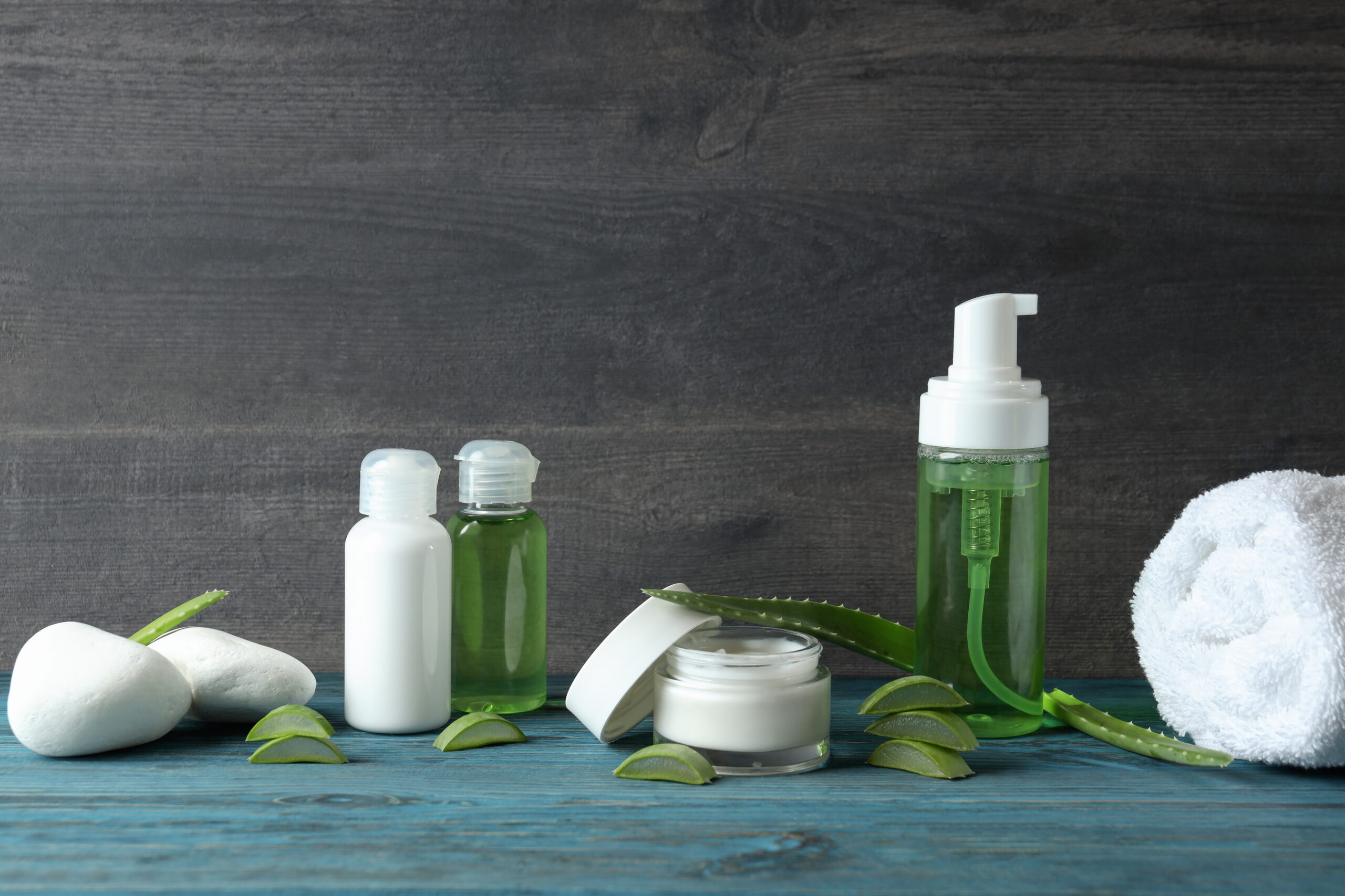 Skin care concept with aloe vera on wooden table Skin care concept with aloe vera on wooden table