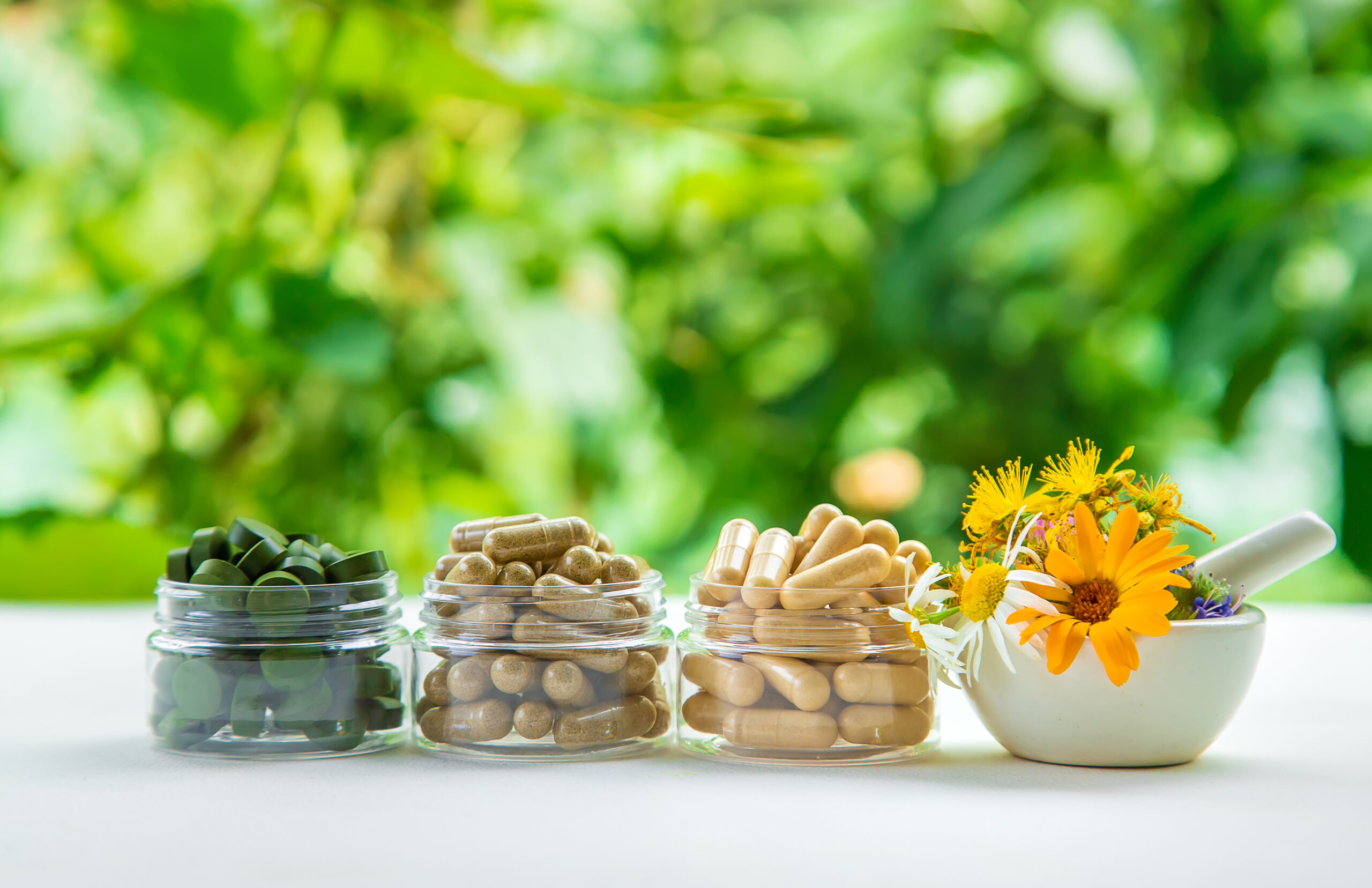 Supplements and vitamins with medicinal herbs. Selective focus. Supplements and vitamins with medicinal herbs. Selective focus. Nature.