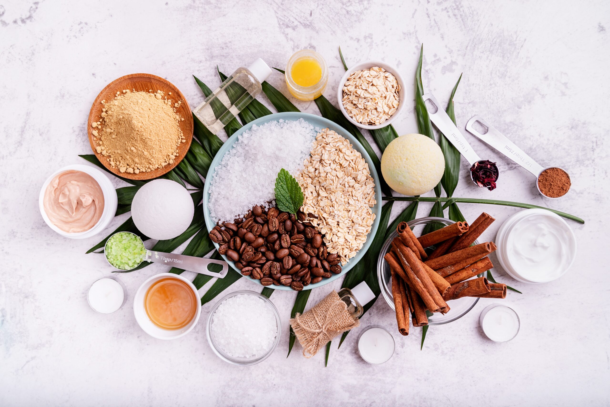 natural cosmetics or spa setting top view flat lay Natural cosmetics concepts. Beautiful spa setting with palm leaf top view flat lay